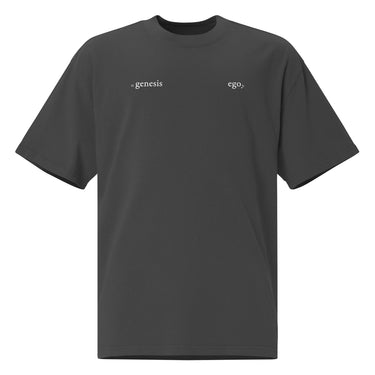 Front view of an oversized tee in black. Design features small text printed across the upper chest: the word ‘genesis’ on the left side, preceded by a circular symbol, and the word ‘ego’ on the right side preceded by a music note.