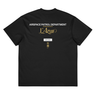 Back view of a box tee in black, flat. A stacked graphic fills the upper back: "AIRSPACE PATROL DEPARTMENT" in heavy white capitals, "GLORIA NOS DUCIT" in smaller gold capitals beneath it, then "L'Azur" in a large gold script with a long trailing flourish. Below sit a small white box lettered "FIRST SPEAR" in black, a weathered gold seal stamp carrying two characters, and "gen 5" in gold.
