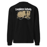 Back view of an longsleeve in black. A large graphic composition spans the upper back, featuring the phrase “Compliance Authority” in bold at the top, with a date range centered beneath it. Below, a rectangular collage combines a textured illustration of a dial-like object and a stylized figure, framed by vertical bars with additional characters. Thin linework of symmetrical wings extends outward from the bottom edge of the collage, adding contrast to the overall layered design.