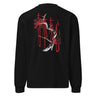 Back view of a longsleeve in black. Four large vermillion brushstroke characters reading "春木灰心" run vertically down the center, layered with a stark white-and-red painterly tree branch winding through them. Two crimson rectangles bracket smaller ink motifs in the upper-left and lower-right, giving the composition an expressive, calligraphic, graphic-forward feel.
