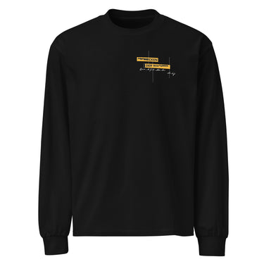 Front view of an longsleeve in black. Design is positioned on the upper left chest. Design features a yellow rectangular label reading “CONNECKEN,” smaller text “DER WÄCHTER,” and fine white script lines and coordinates below it.