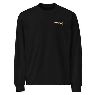 Front view of an longsleeve in black. A minimalist design placed on the upper left chest shows a compact arrangement of small graphic elements, including a circular icon, the word “KRAMPUS” in bold, and a narrow vertical block with stylized symbols.