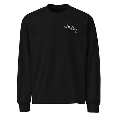 Front view of a longsleeve in black. A small left-chest graphic reads 'SOLA EGO' in a high-contrast serif, split across two lines, with two four-pointed star accents in dusty pink flanking the type.