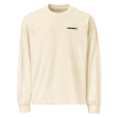 Front view of an longsleeve in beige. A minimalist design placed on the upper left chest shows a compact arrangement of small graphic elements, including a circular icon, the word “KRAMPUS” in bold, and a narrow vertical block with stylized symbols.
