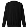 Front view of an sweatshirt in black. Minimal design featuring a small white lowercase word “constance” centered across the upper chest. The typography is clean and modern, standing out subtly against the solid black fabric.