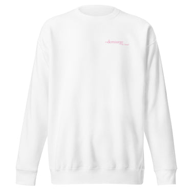 Front view of an sweatshirt in white. Design features a small, minimal text print placed on the upper left chest. The word “demiurge” appears in a clean serif font, preceded by a small infinity-shaped symbol. Just beneath it, in tiny handwritten script, the phrase “the mind” is printed in quotation marks.