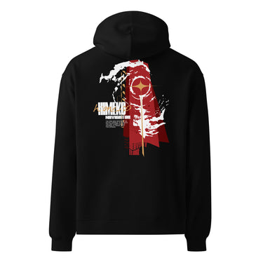 Back view of a Oversized Hoodie in Black. a large back graphic centered on a jagged, torn-map style emblem in white with a glowing star burst at its center, layered over angled orange-red geometric panels resembling sail or flag fragments, alongside a bold two-line wordmark, a short block of descriptive text, and a smaller diagonal wordmark near the hem