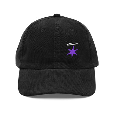 Front view of a corduroy cap in black. An embroidered white halo floats above a six-pointed violet star on the ridged corduroy front panels, above a curved brim on a low-profile crown.