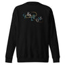 Front view of a solid-colored sweatshirt. A graphic on the chest features the letters spelling "CURSED ONE" scattered and layered in a mix of high-contrast fonts, intertwined with a fine swirling line.