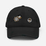 Front view of a solid-colored, distressed hat. The front features two different embroidered circular emblems with abstract patterns.